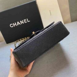 This is CHANEL Caviar Quilted Small Double Flap in Black. This shoulder bag is crafted of luxurious diamond-quilted caviar leather in black.