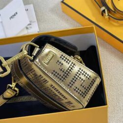 Iconic, boxy mini Baguette bag from the Versace by Fendi collection. Made of gold-coloured leather with FF motif gold laser-cut perforations that create an effect that evokes the Versace metal mesh.